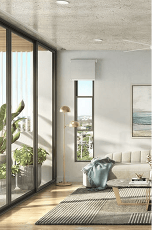 Modern living room with large glass sliding doors and balcony view.